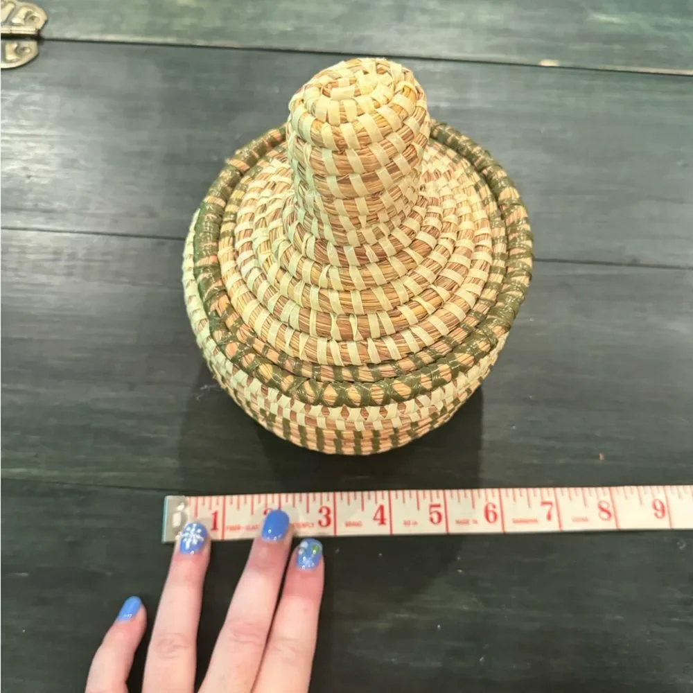 Handwoven sweetgrass coiled basket with a fitted lid